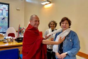 Dr Arjumand Zaidi is being felicitated by the Budhist Priest at Songtsen Library Dehradun.